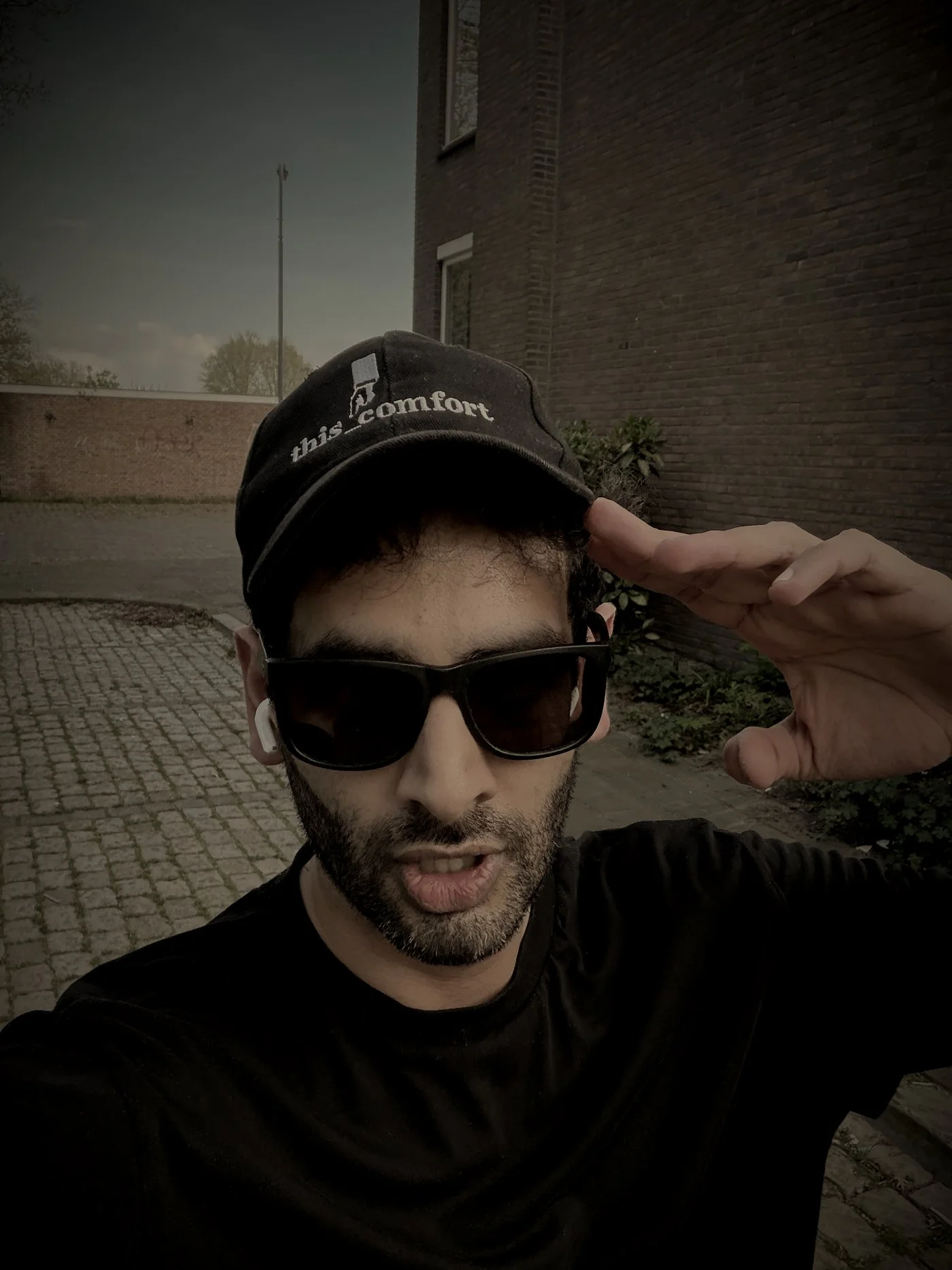 Shiv in a this_comfort cap and sunglasses